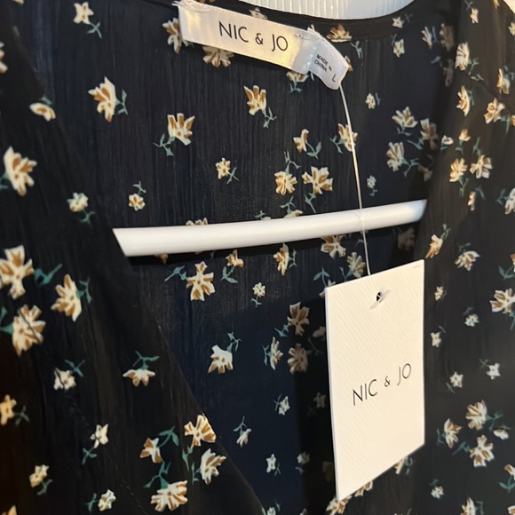 NWT.  Beautiful flowy midi dress.  Black with small floral pattern. - Picture 2 of 3